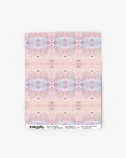 A sheet of light raspberry, abstract-patterned paper with the brand name "Setting Sun Wallpaper||Light Raspberry" and product details printed at the bottom.