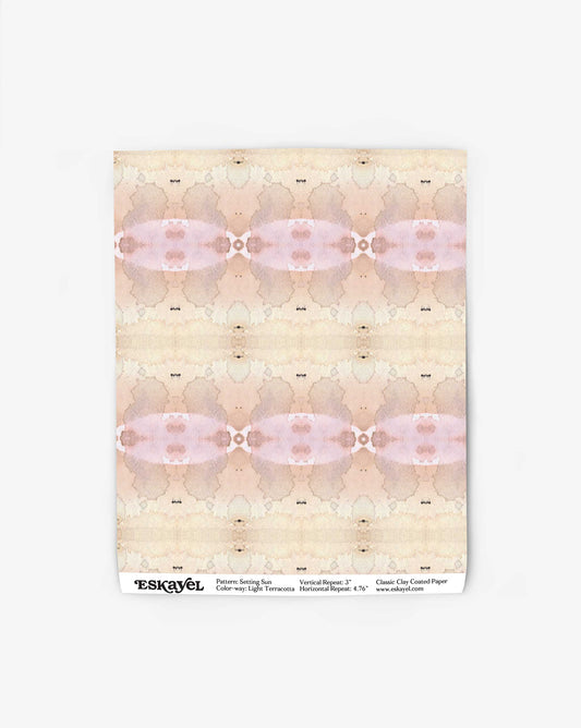 Abstract watercolor art on a vertical sheet with hues of beige, pink, and gray from the Frontier Collection. The bottom features the text: "Setting Sun Wallpaper||Light Terracotta Pattern: Samui Isle, Colorway: Light Terracotta, Material: Repeat 15×19.2", www.eskayel.com.