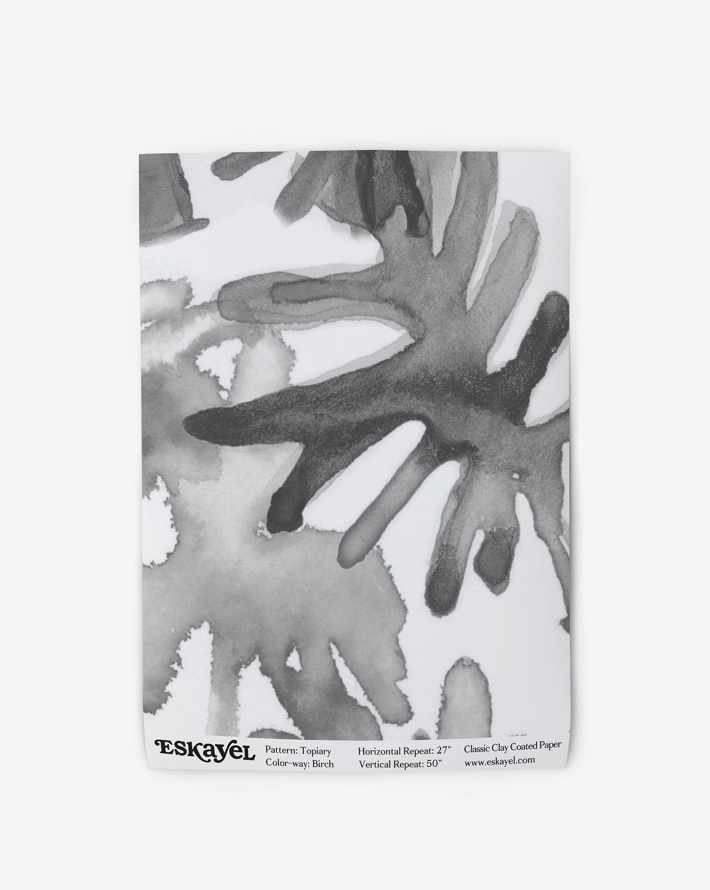 A black and white watercolor painting on a Topiary Wallpaper Sample Birch background can be ordered