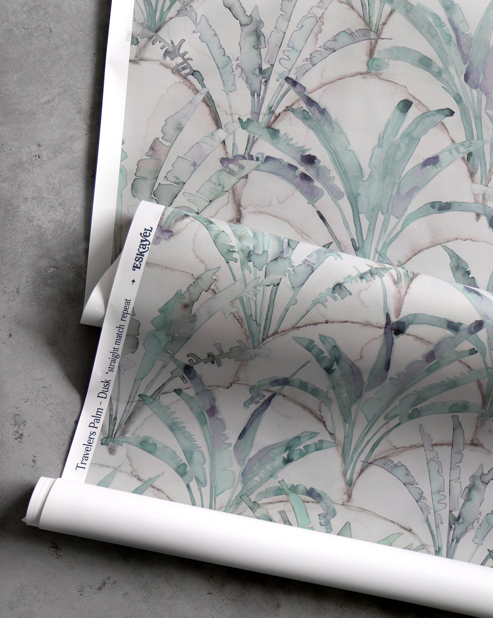 A roll of Travelers Palm Wallpaper Dusk, featuring a clay coated finish suitable for travelers palm