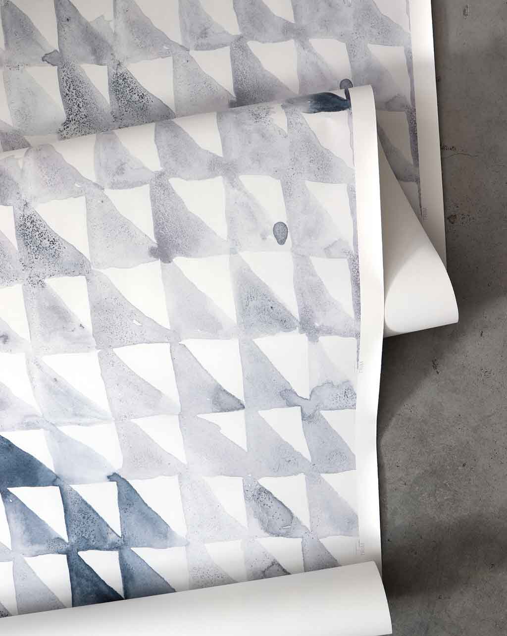 A roll of Triangle Checks Wallpaper Ocean with a pattern of geometric sequences from the Triangle Checks collection on it
