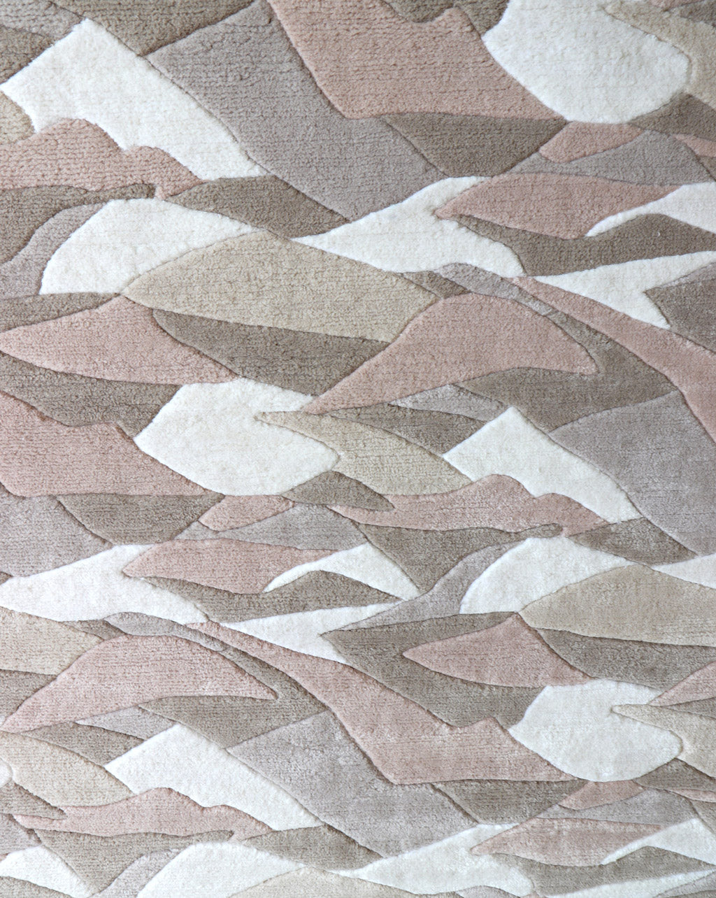 A Mani Hand Knotted Rug 5' x 8' with a pattern of mountains on it, made of merino wool