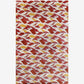 As a merino wool rug, our Mani pattern in Fire uses a palette that includes white, sand, light blue, and terracotta red