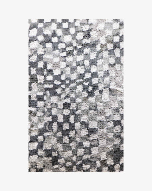 A Chess Hand Knotted Rug 5' x 8' in Greyscale, made of 100% wool, with squares on it