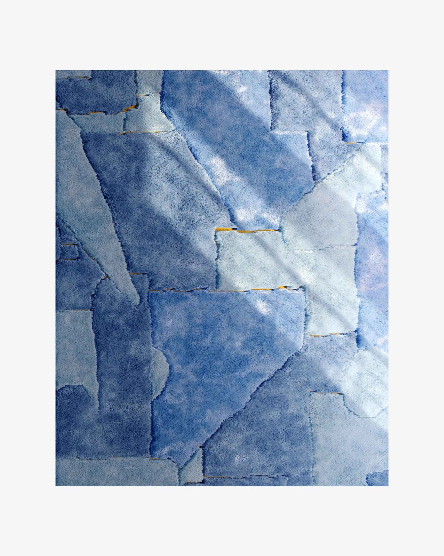 Eskayel’s Pieces rug in the Sky and Sun colorway is a flatweave base of yellow and orange against shaggy pile sections in shades of blue.
