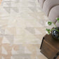 A living room with a beige Triangle Checks Hand Knotted Rug Sol