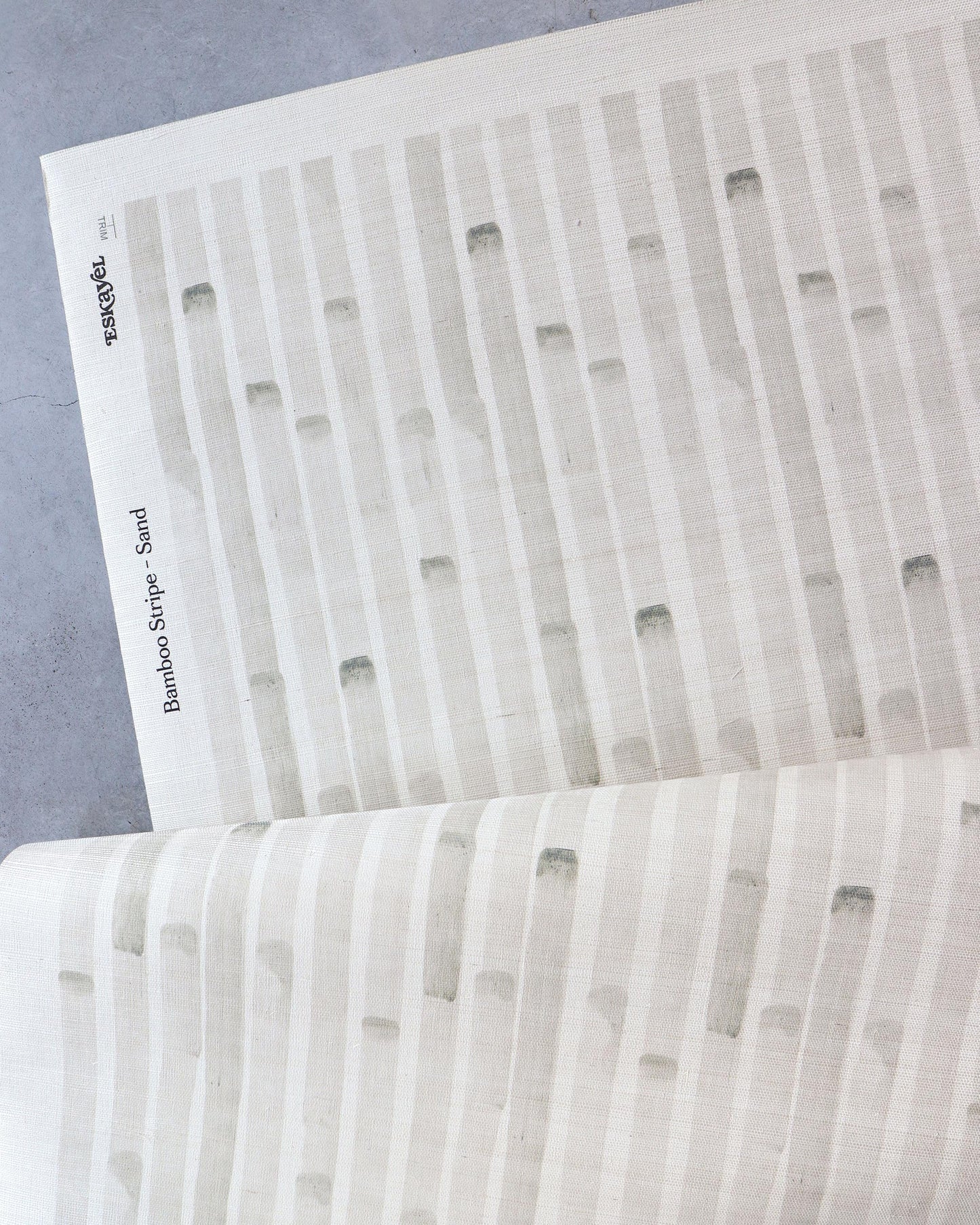A Bamboo Stripe Grasscloth Sand made from high-end wallcoverings