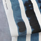 A Bold Stripe Grasscloth Azure fabric with stripes on it