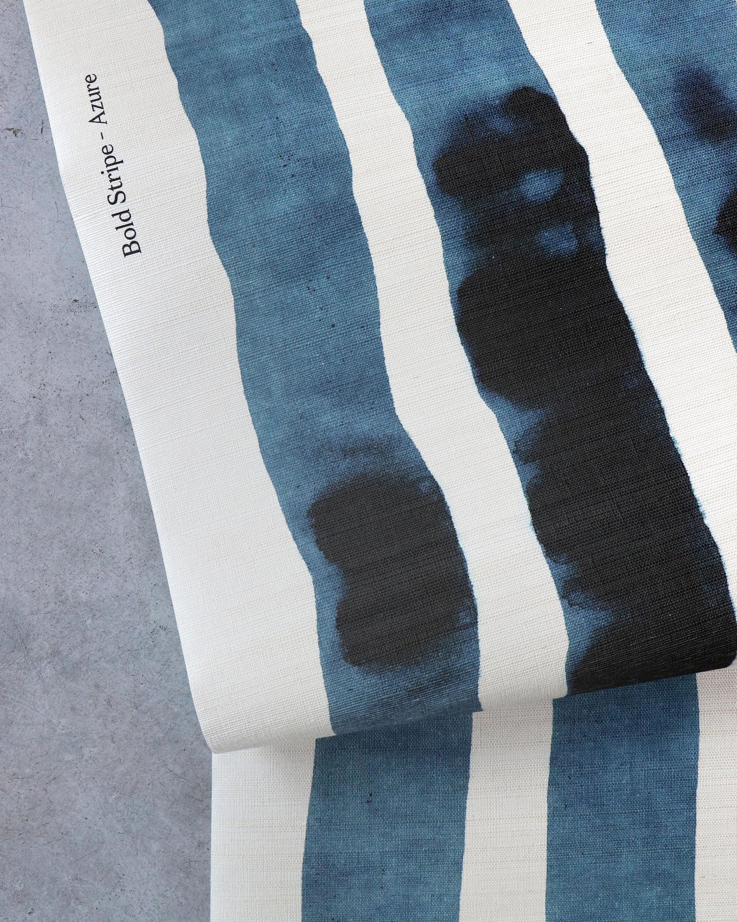 A Bold Stripe Grasscloth Azure fabric with stripes on it