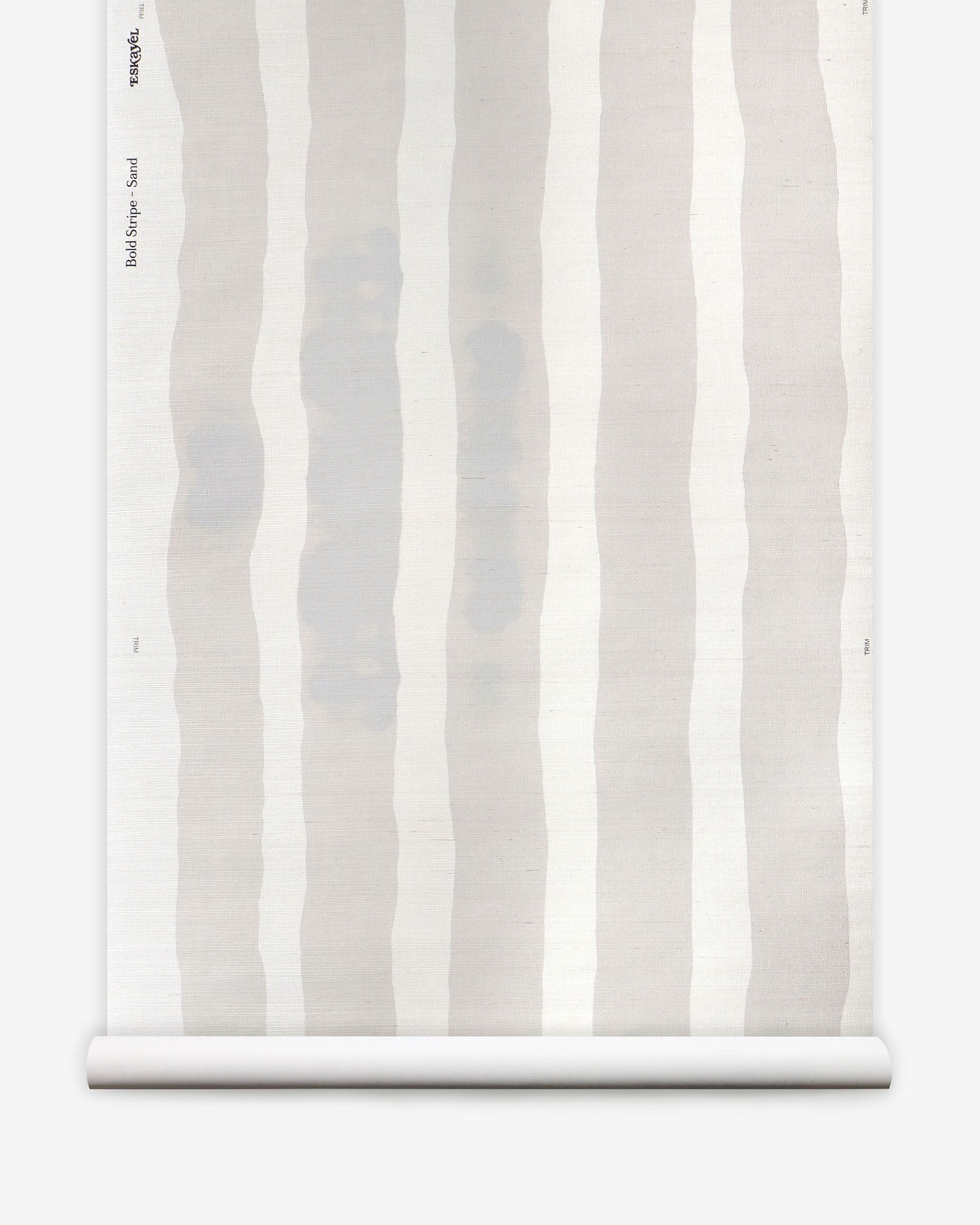 A roll of wallpaper with white and grey stripes from the Bold Stripe Grasscloth Sand collection by Eskayel