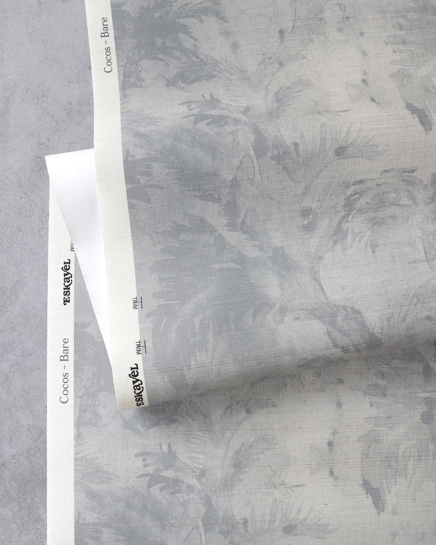 A grey and white patterned paper with Cocos Grasscloth Bare and palm tree motifs