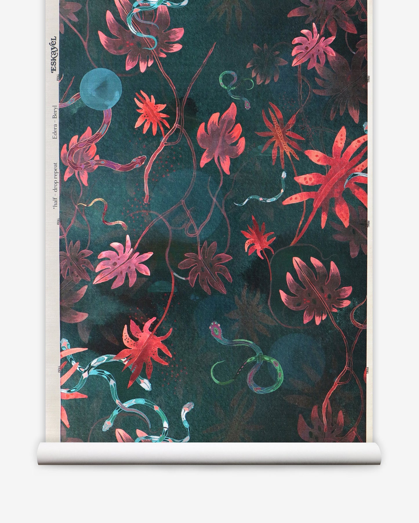 A roll of Edera Grasscloth Beryl with a chinoiserie-inspired pattern of red and green flowers on it, in collaboration with Edera and Eskayel
