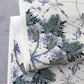 A luxury fabric with Laurel Forest Grasscloth Punta watercolor brushstrokes