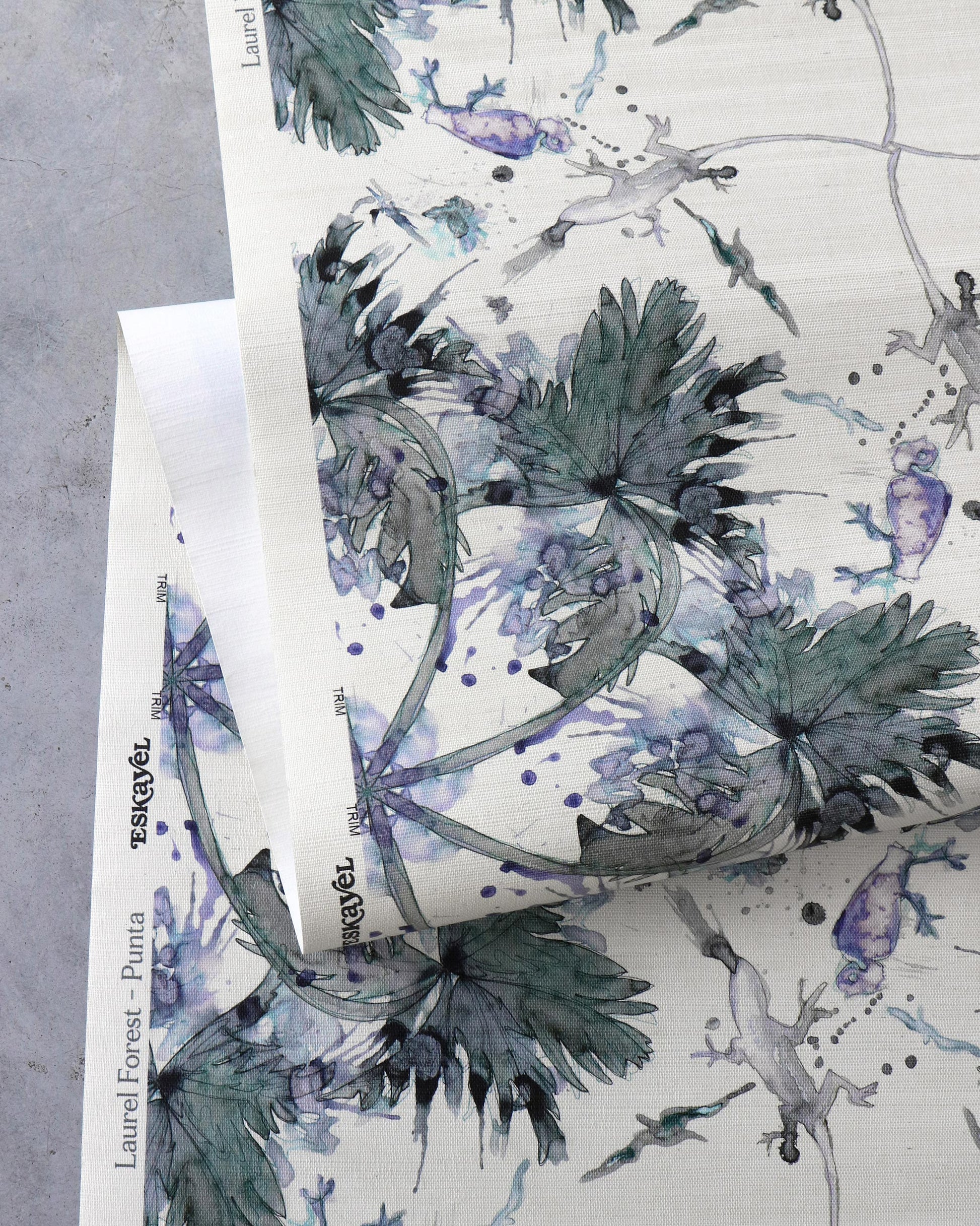 A luxury fabric with Laurel Forest Grasscloth Punta watercolor brushstrokes