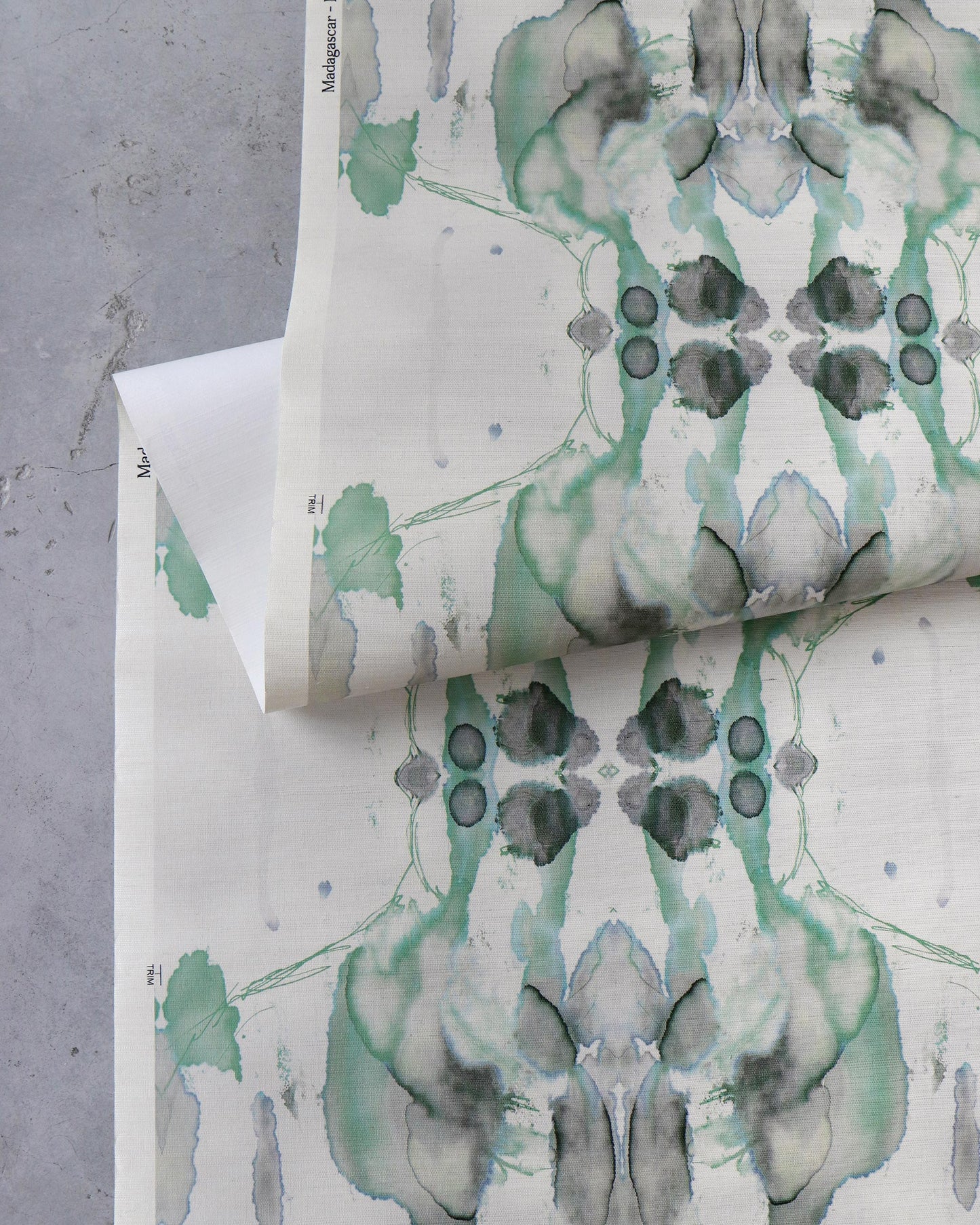 A high-end Madagascar Grasscloth Moss with green and white flowers on it