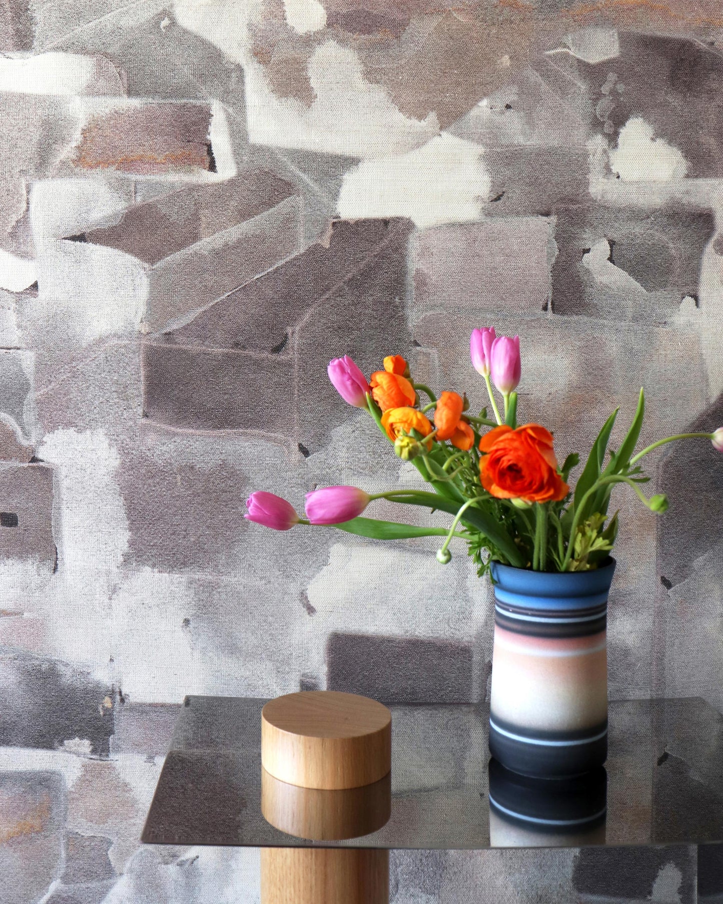 A Medina Grasscloth Pausa on a table in front of a wall