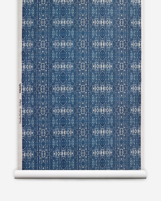 A blue and white pattern on a roll of Omaha Kinship Grasscloth Indigo ikat