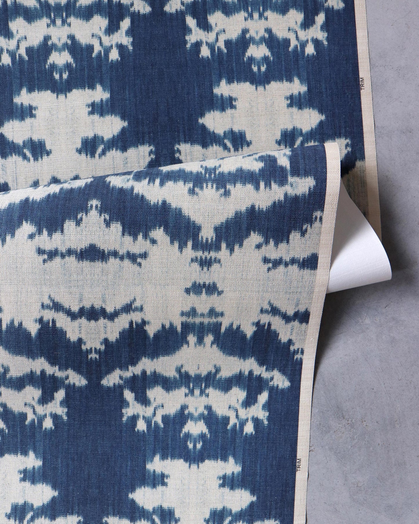 A blue and white The Dance Grasscloth on a table