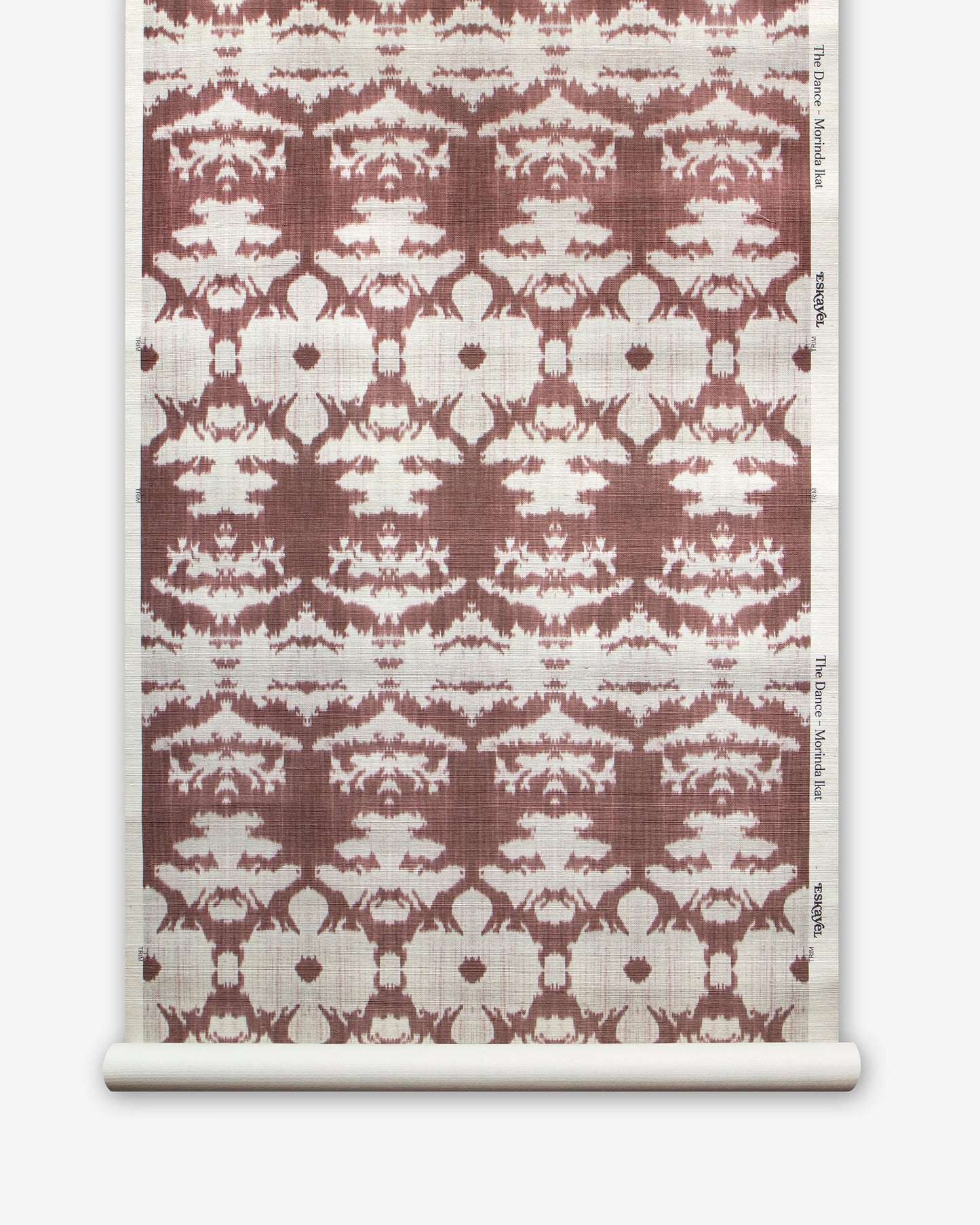 A roll of The Dance Grasscloth Morinda Ikat wallcovering from the Lora Collection with a brown and white pattern