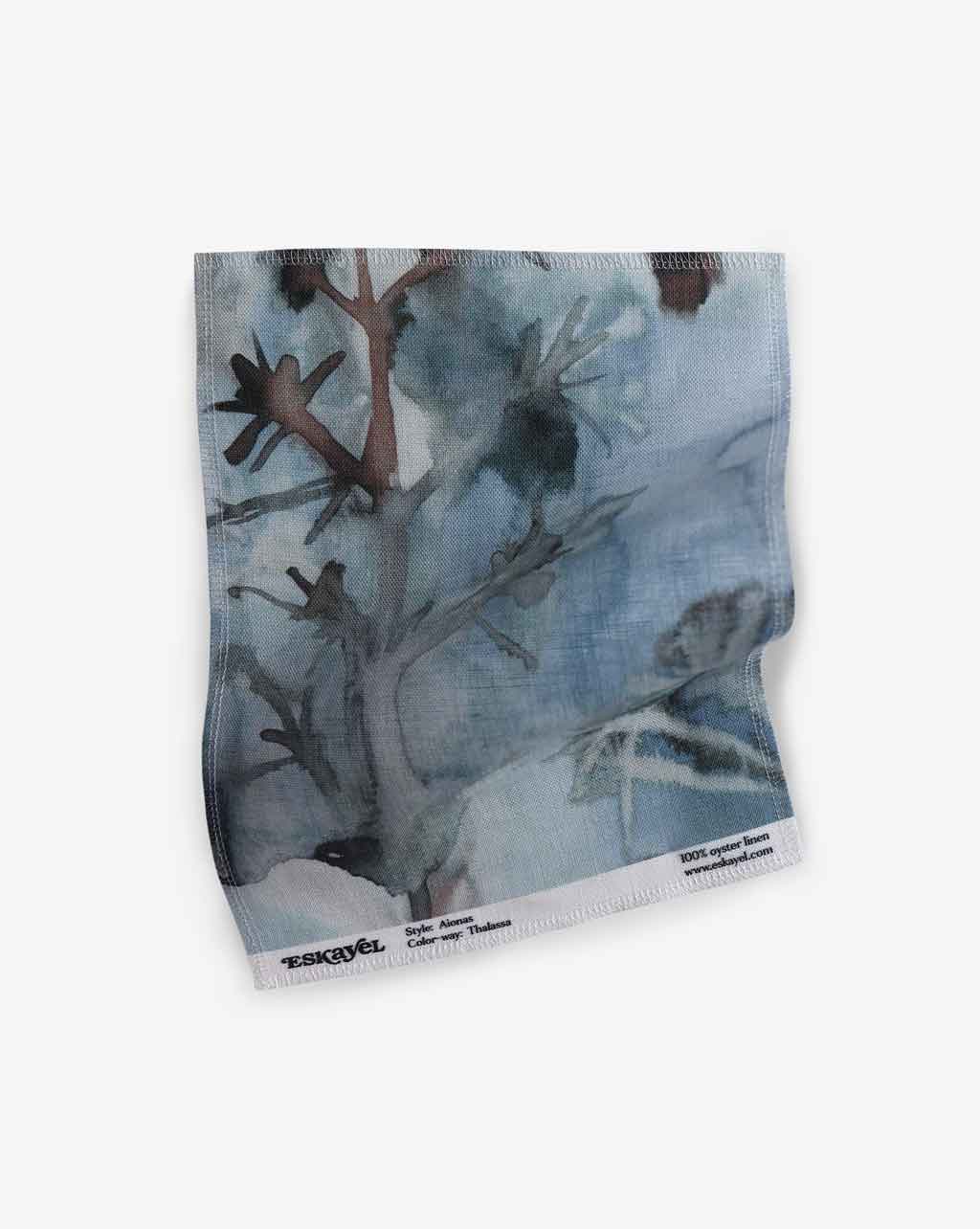 A watercolor painting of a tree on a piece of Aionas Fabric with Thalassa wallpaper backdrop