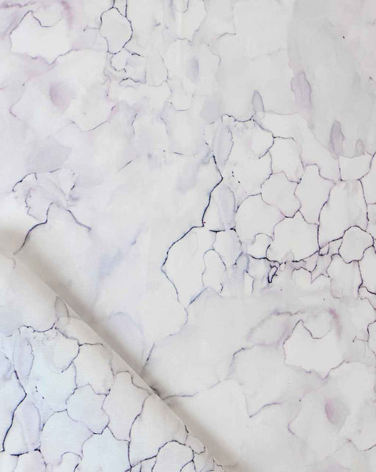 A white and purple marble pattern on a piece of Aquarelle Fabric Ice