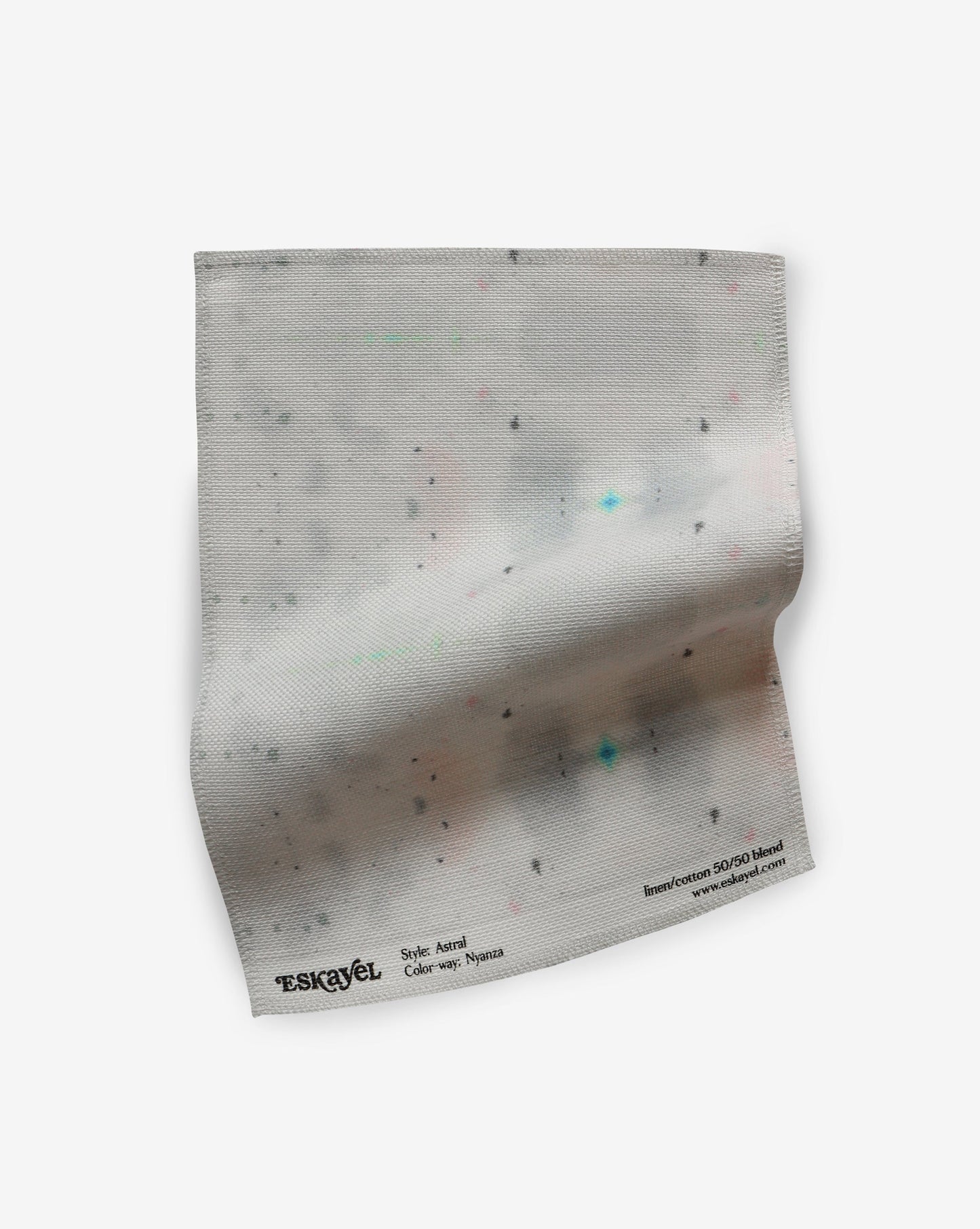 An Astral Fabric Sample Nyanza with dots on it