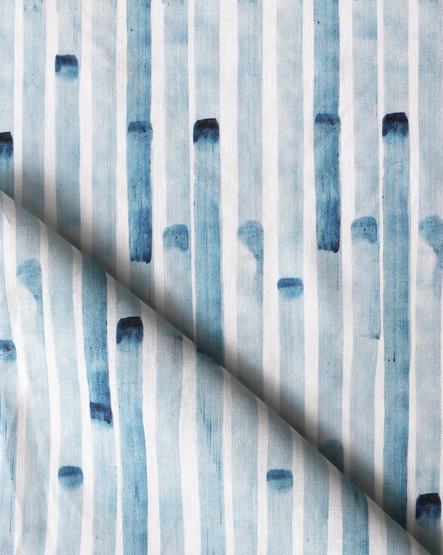 A close up of blue and white striped Bamboo Stripe Fabric Azure from the Eskayel wallpaper range