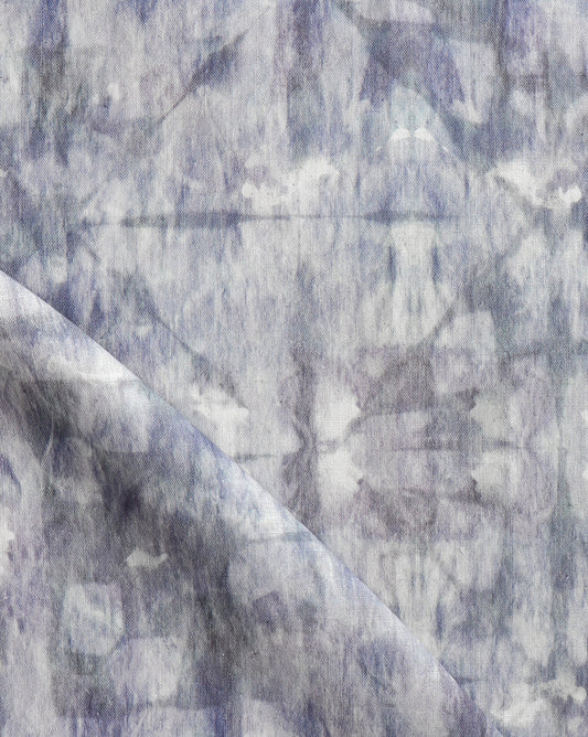 A close up image of a blue and white Banda Fabric Dove showcasing tie-dye techniques