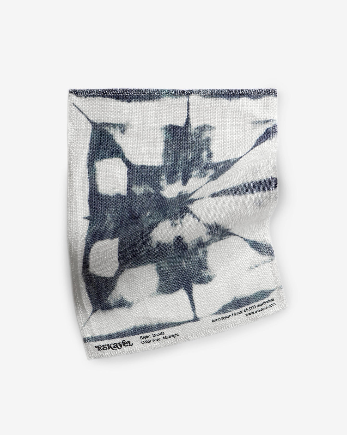 A black and white Banda Fabric Midnight Eskayel favorite fabric on a white surface