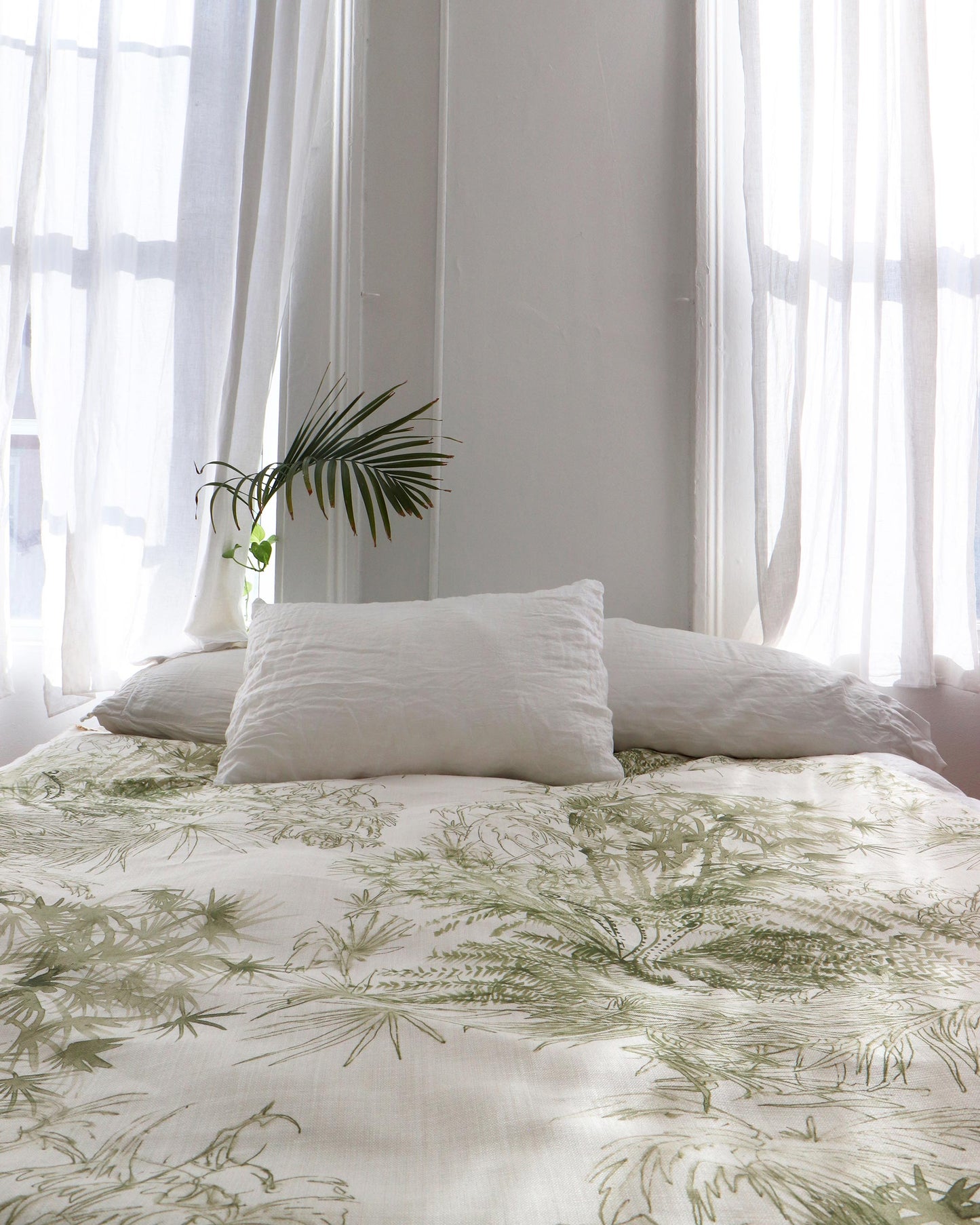 A bed with a luxurious Domenica Fabric Brush bedding fabric
