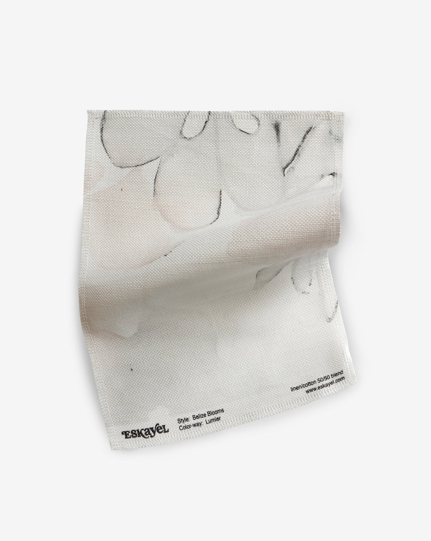 A Belize Blooms Fabric Sample fabric with black and white flowers on it