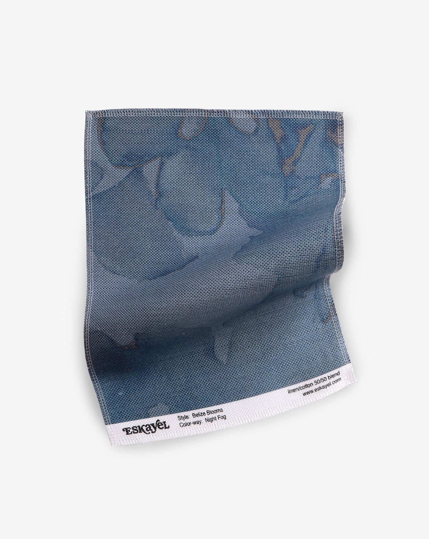 To a sample of the Belize Blooms Fabric Sample Night Fog with flowers on it