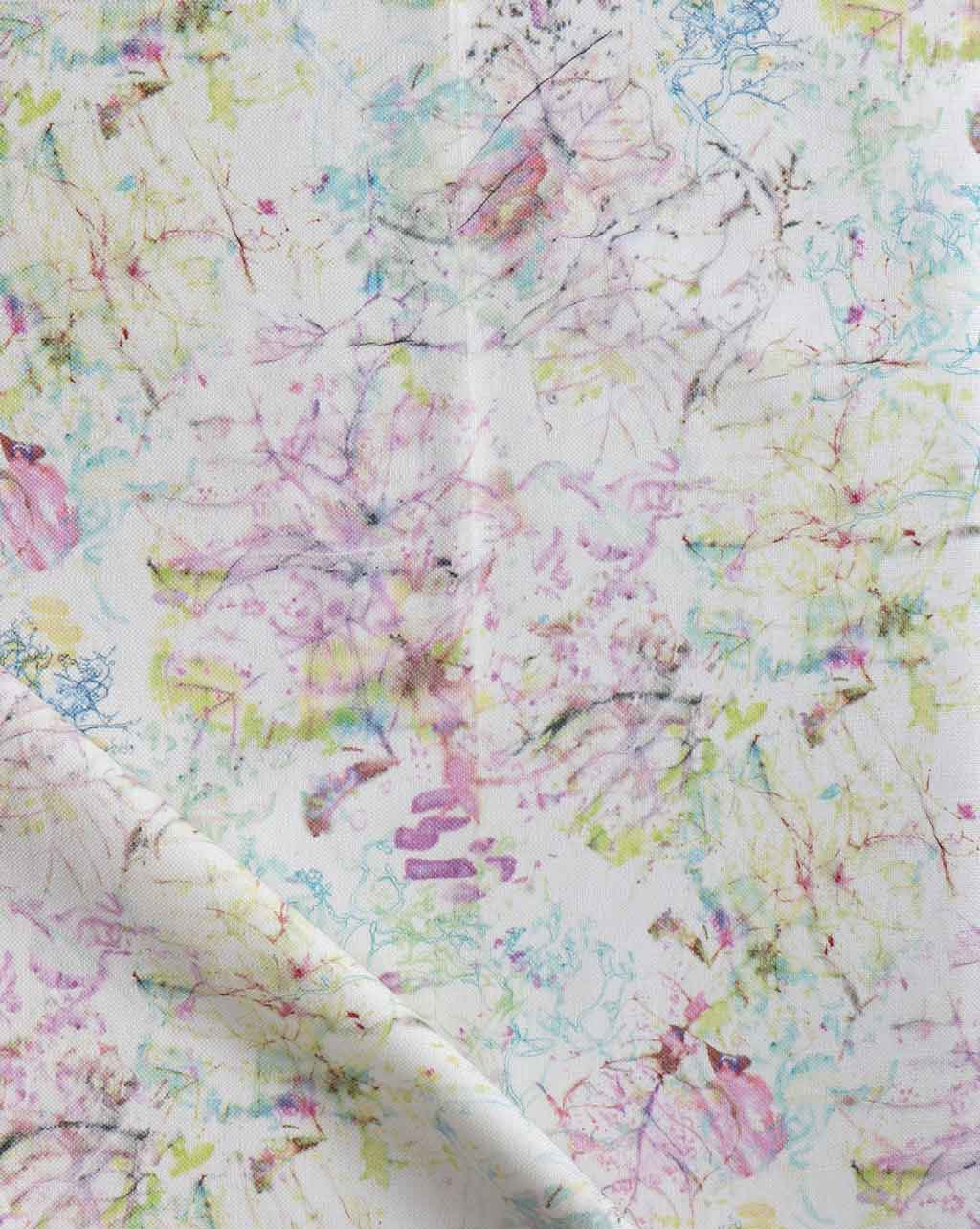 A white fabric with colorful Bosky Toile Fabric Polychrome flowers on it