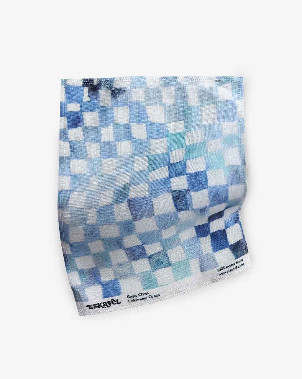 A blue and white checkered Chess Fabric Ocean pattern on a white background