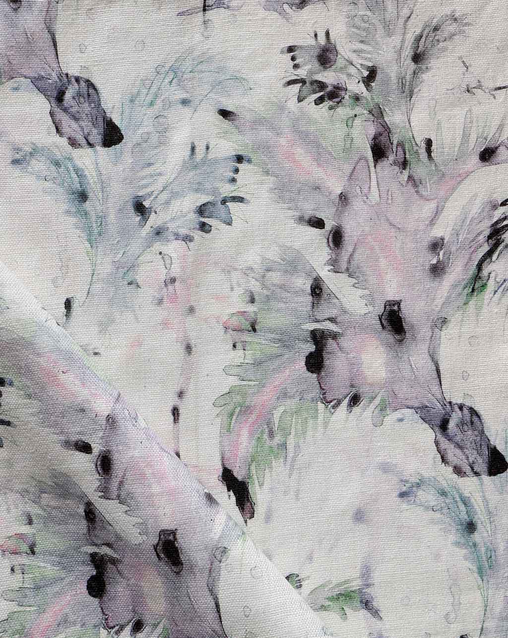 A close up of Cocos Fabric Cay with a pink and purple palm tree motifs pattern