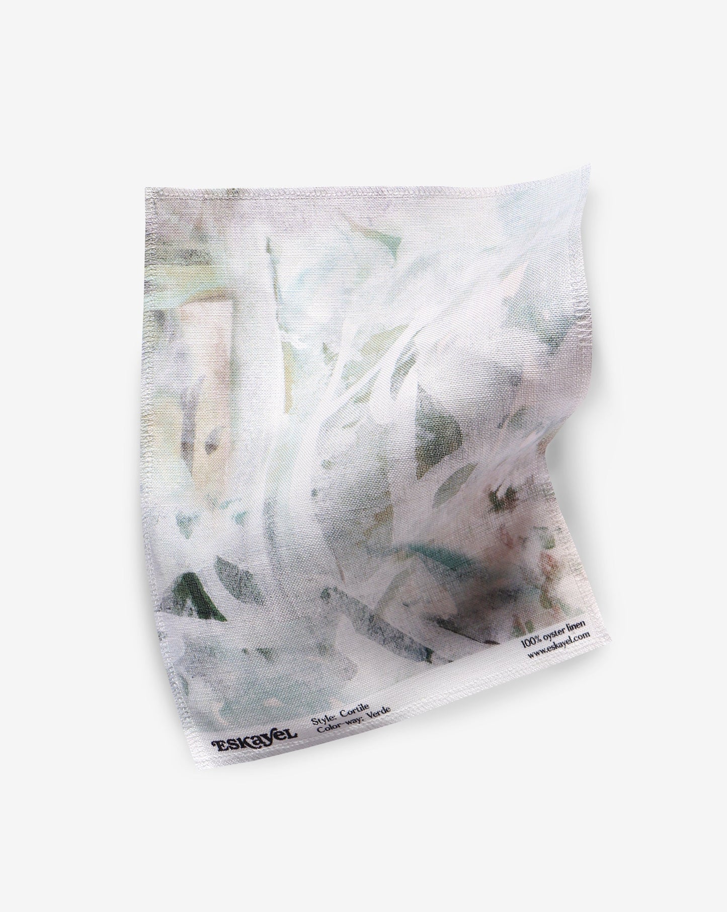 A piece of Cortile Fabric Verde with a custom painting on it