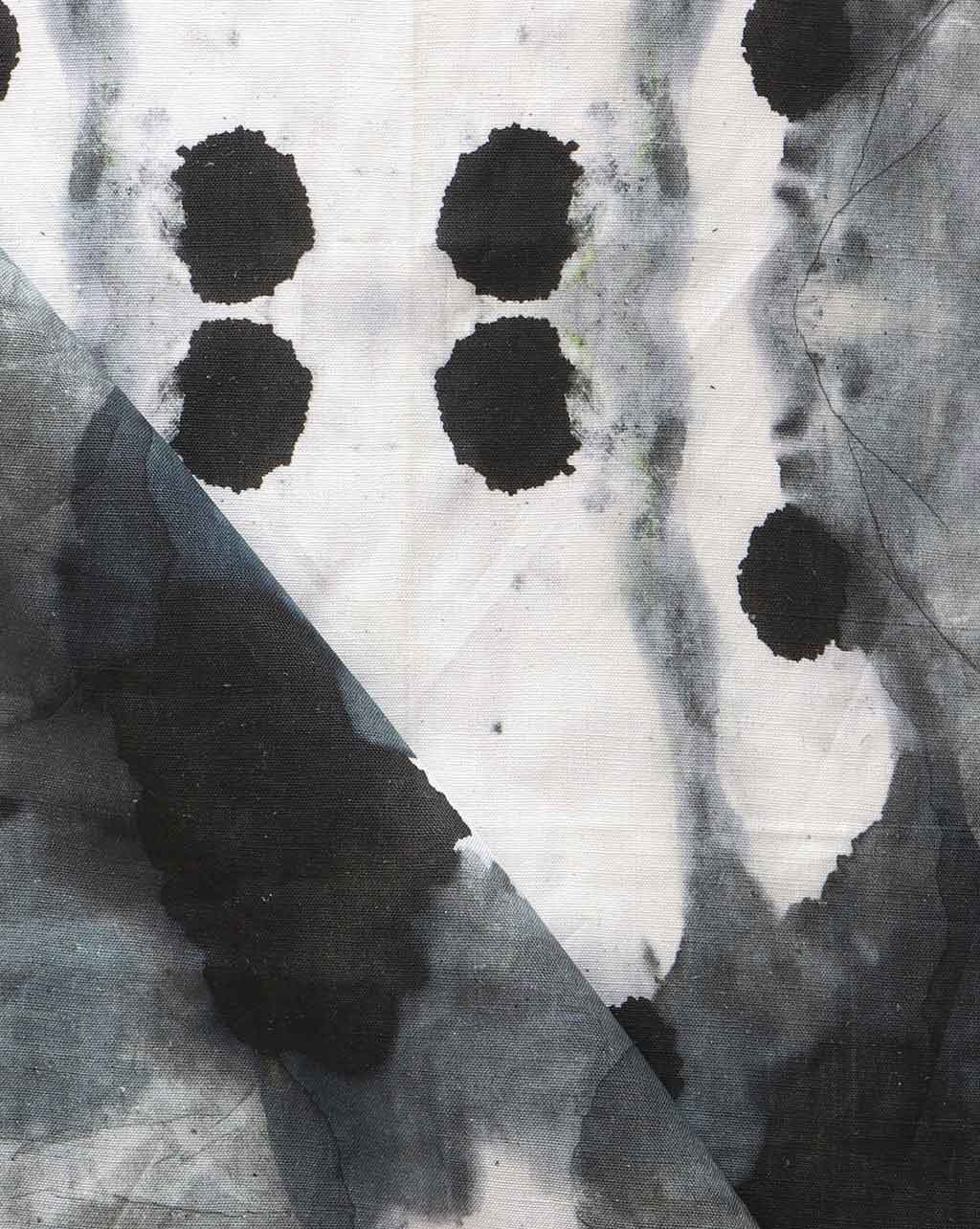 A luxury Dynasty Fabric Indigo with an ink blot design featuring black and white dots on it