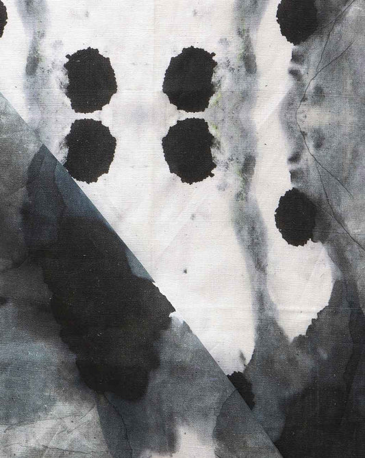 A luxury Dynasty Fabric Indigo with an ink blot design featuring black and white dots on it