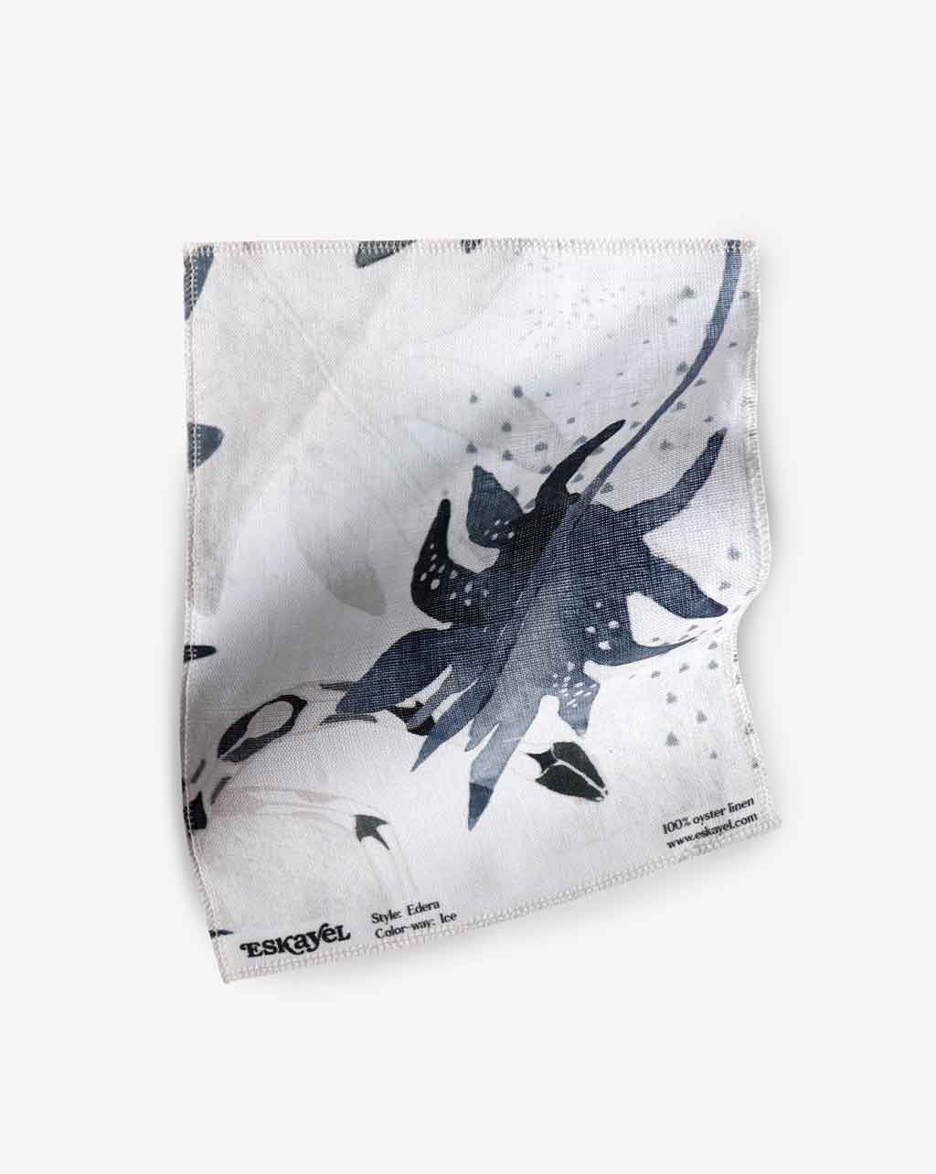 A blue and white Edera Fabric Sample Ice with flowers on it