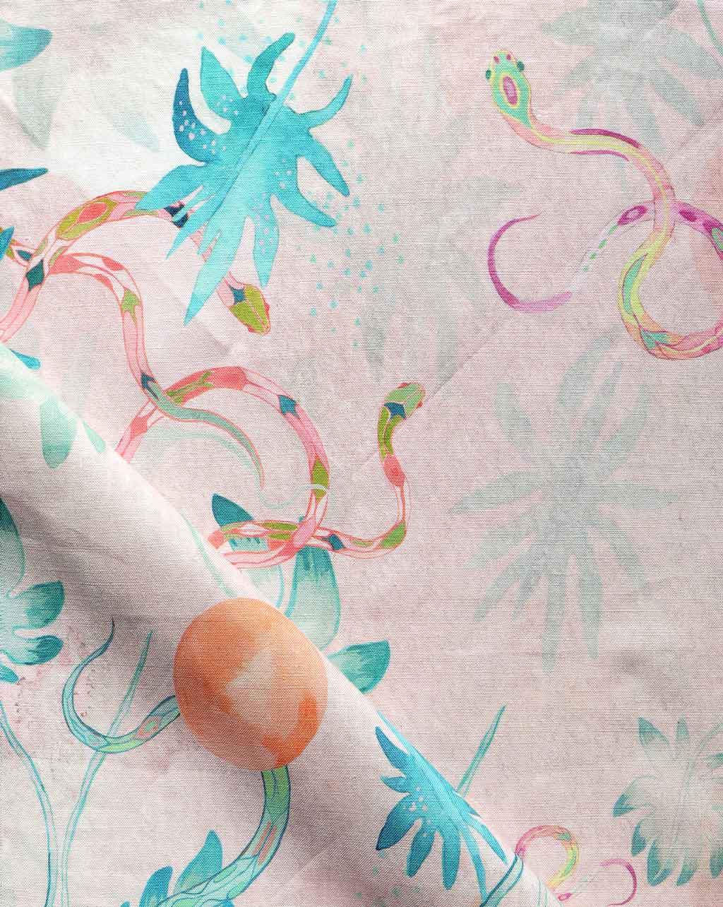A fabric with a chinoiserie-inspired pattern and an Edera Fabric Stucco flower