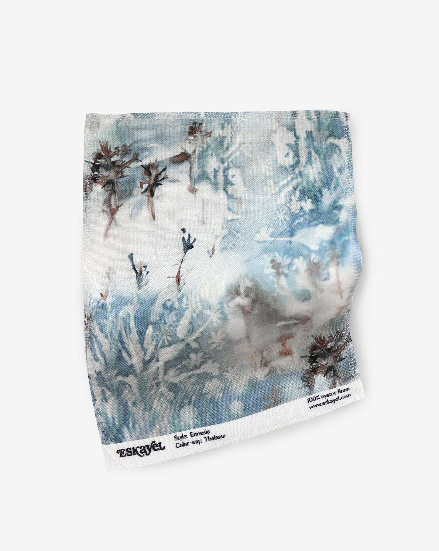 a sample of an Emvasia Fabric Sample Thalassa with a blue and white painting on it