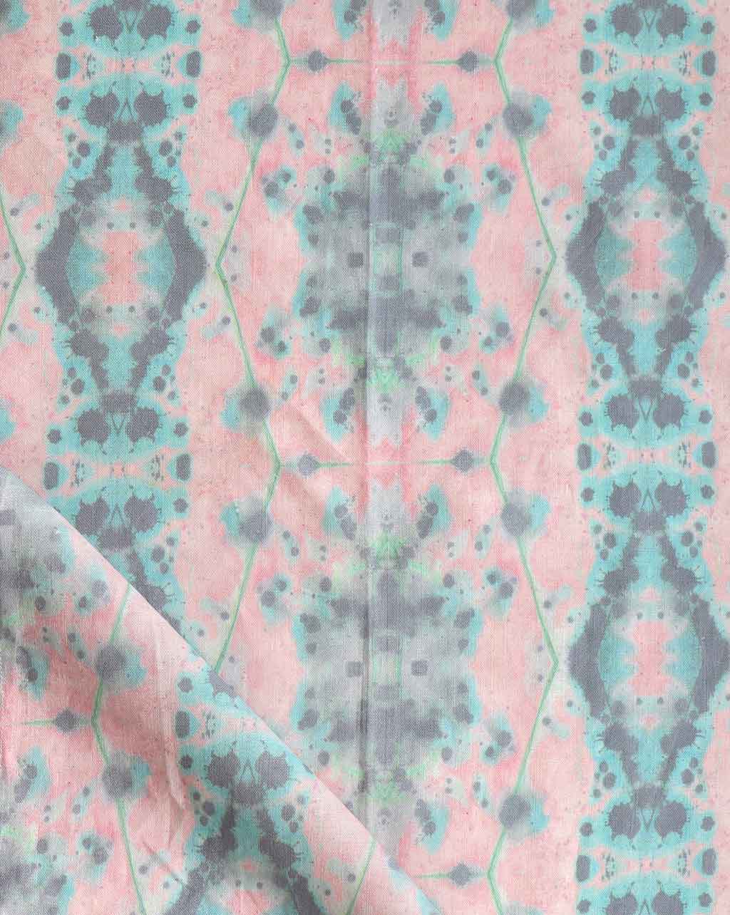 A pink and blue fabric with a Hive Fabric Citron pattern on it