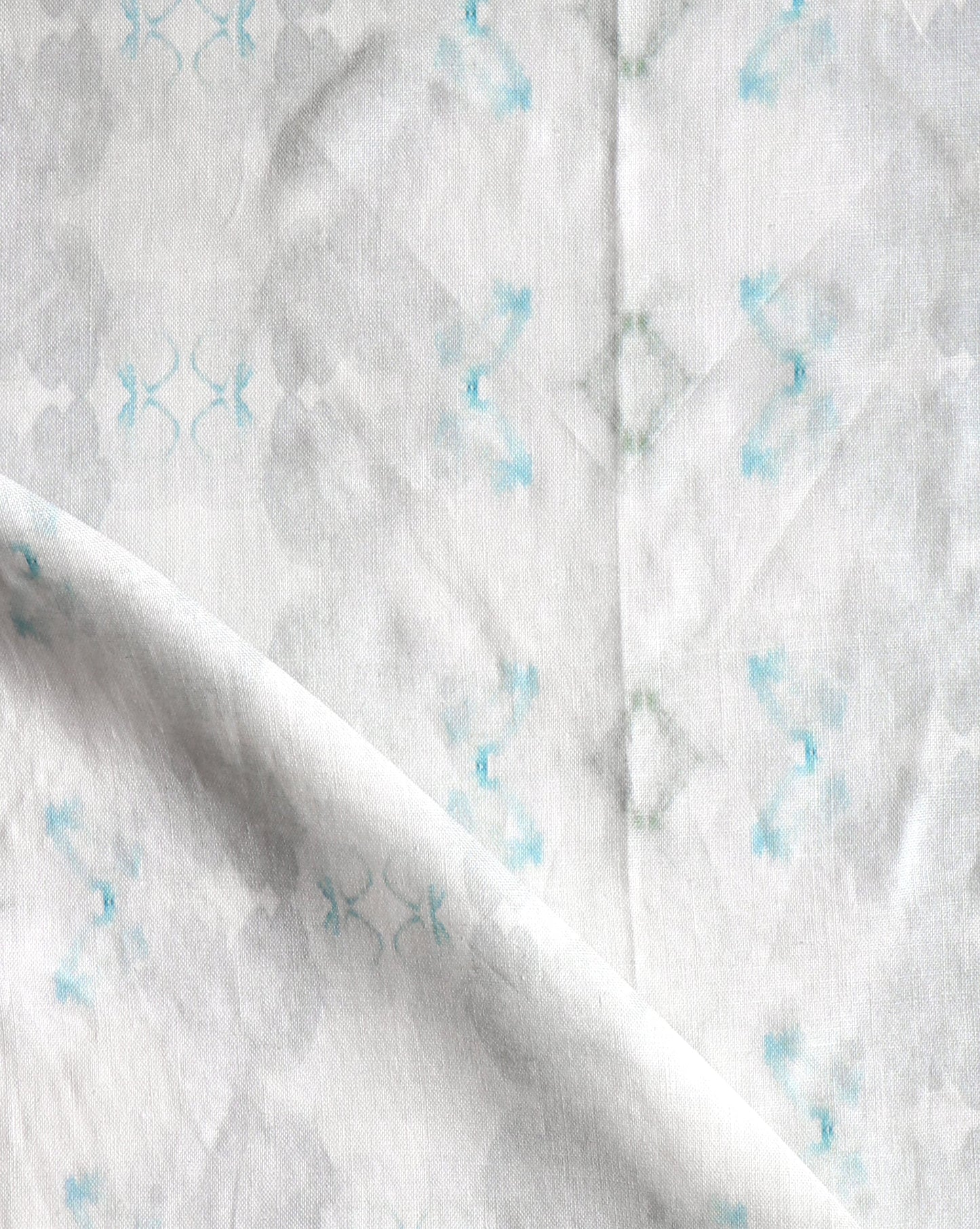A close up of Icelandic Mist Fabric with blue and white designs