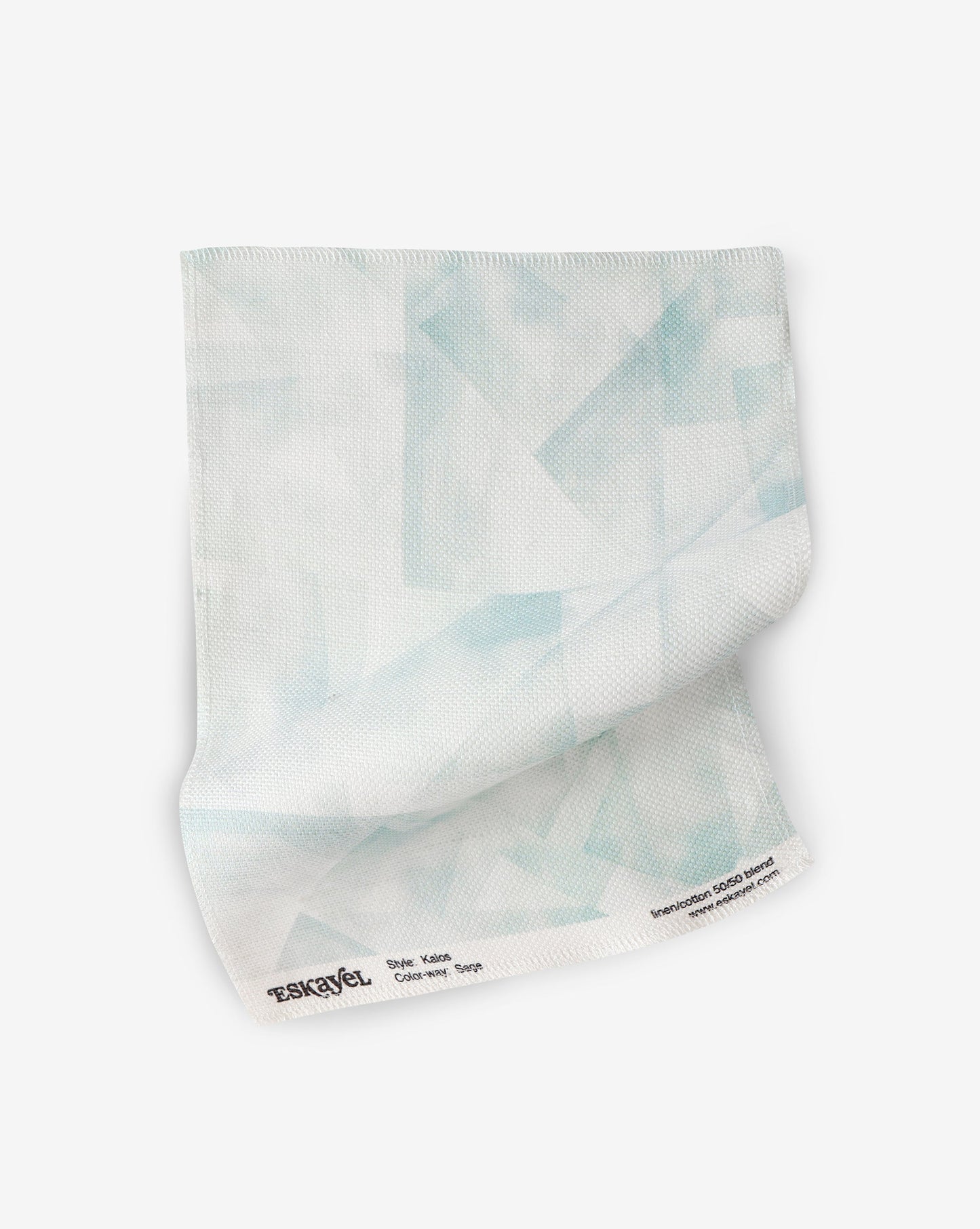 A white Kalos Fabric Sage fabric adorning blue triangles, inspired by the Canadian Pacific Northwest