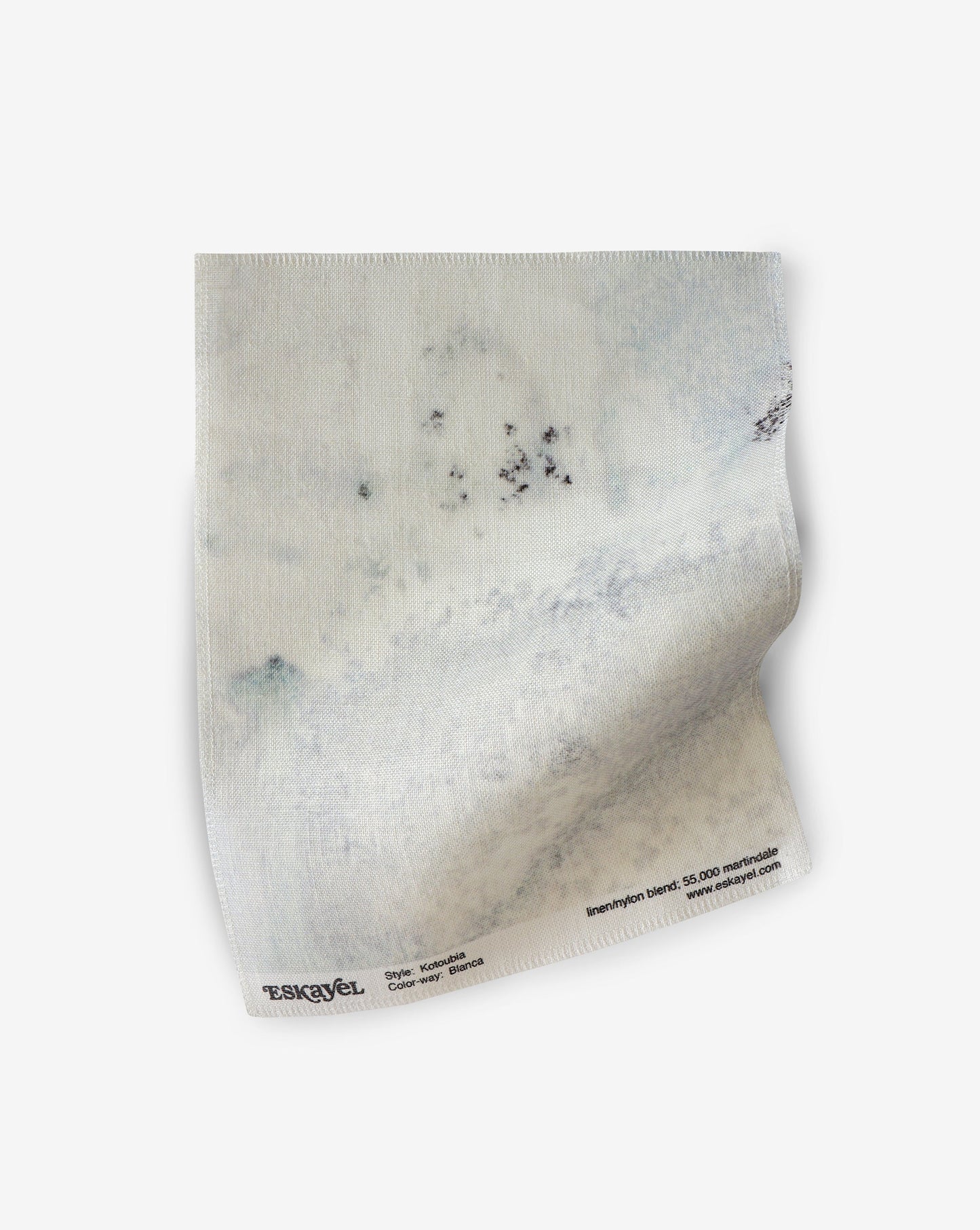 A white piece of Kotoubia Fabric with a Kotoubia picture on it