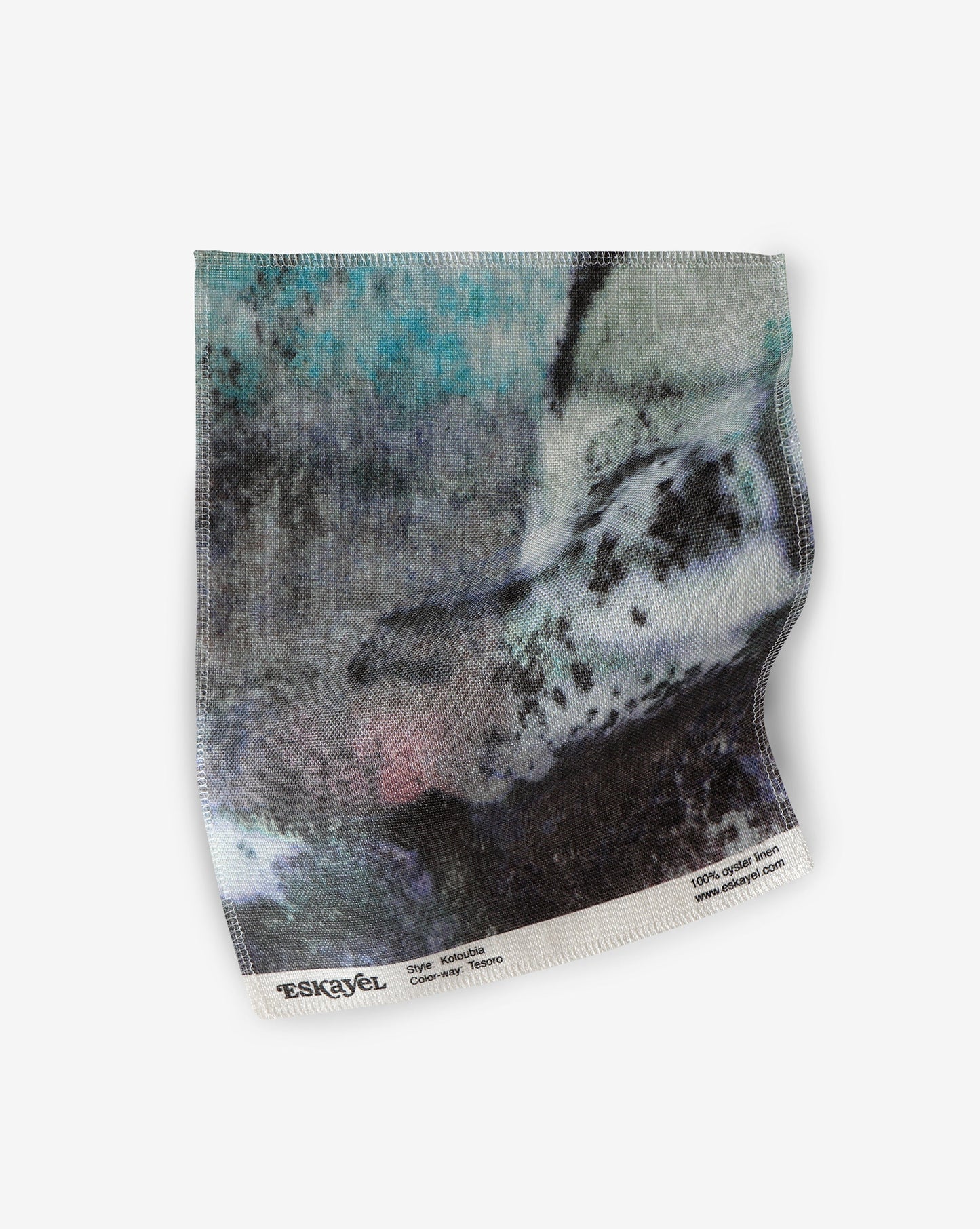 a sample of the Kotoubia Fabric Sample Tesoro hand fabric with a black and white image on it