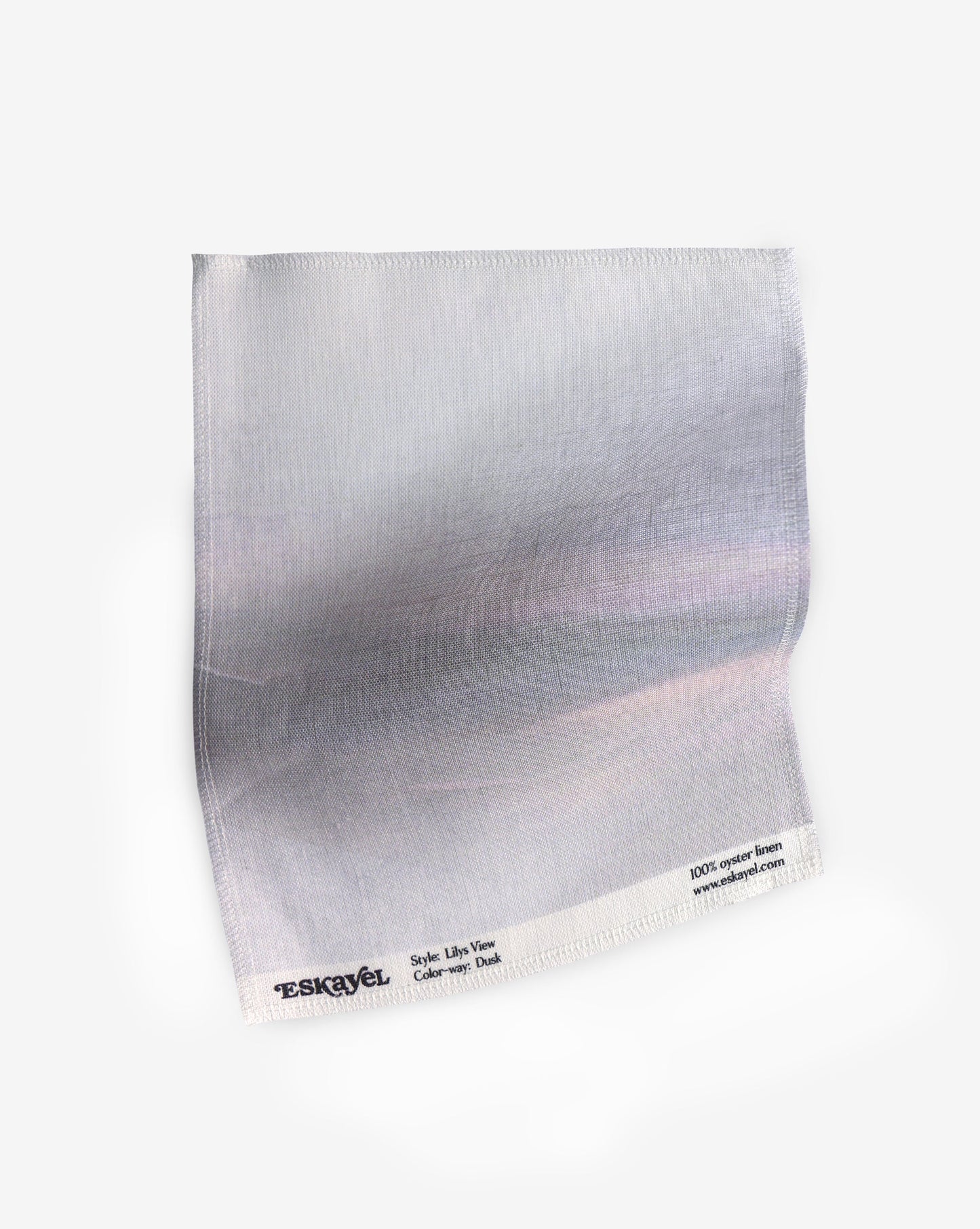 A white piece of paper with luxury engineered Lily's View Fabric Dusk background from Eskayel's Lily's View Collection