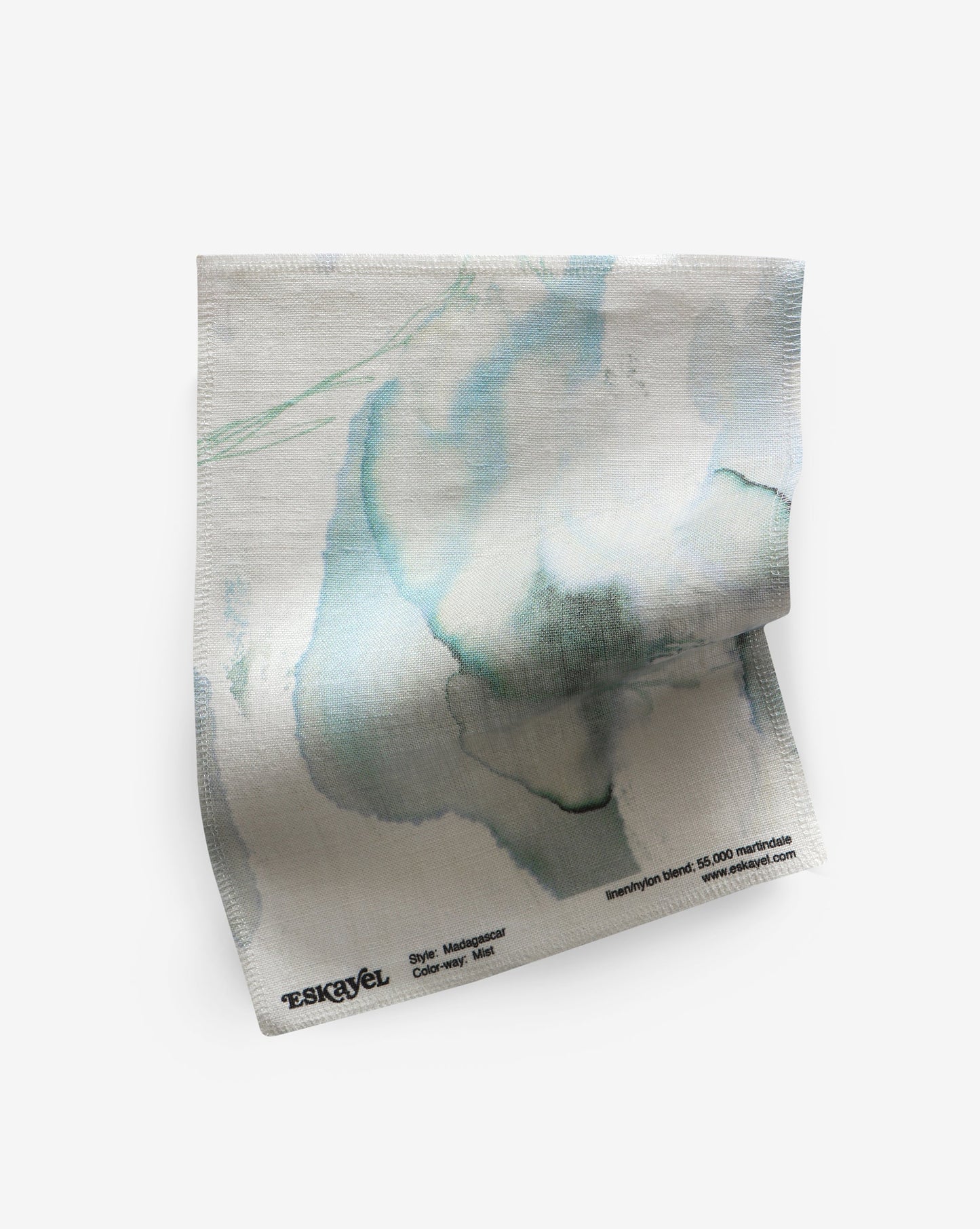 A blue and green design on a Madagascar Fabric Sample Mist paper