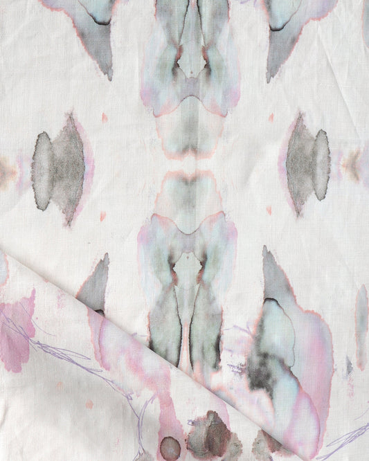 A Madagascar Fabric Rose with a pink and blue pattern on it, inspired by Eskayel's high-end design from Madagascar