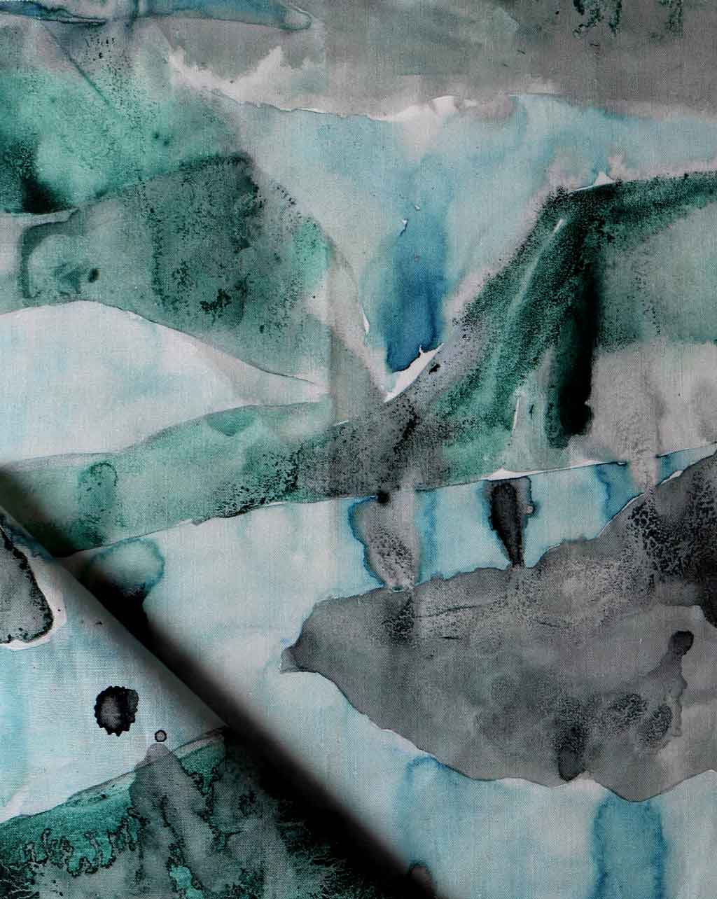 A close up of a watercolor painting on Mani Fabric Gulf in a turquoise colorway